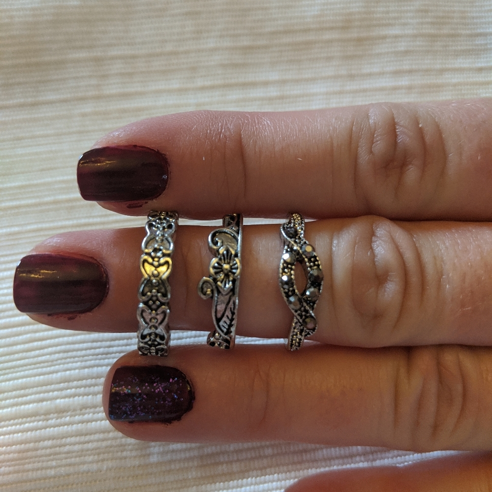 set of three detailed silver rings